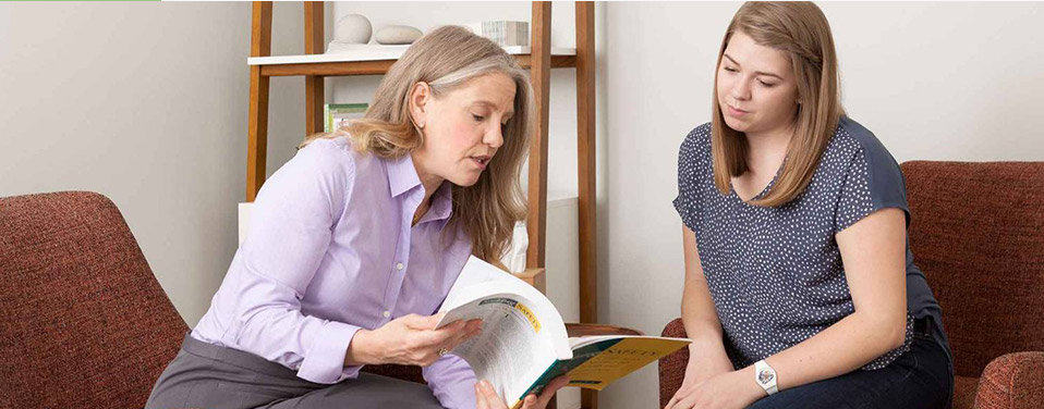 Two women, a Counselor and patient, exploring options of care in Mountainside's Continuing Care