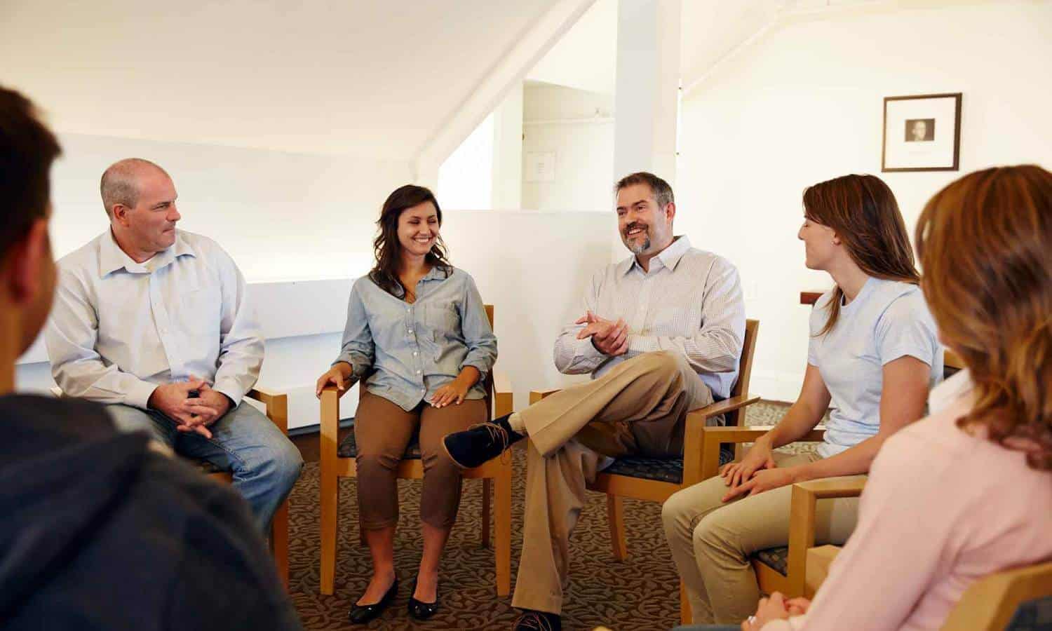 Circle group of men and women in peer support group in Mountainside Treatment Center