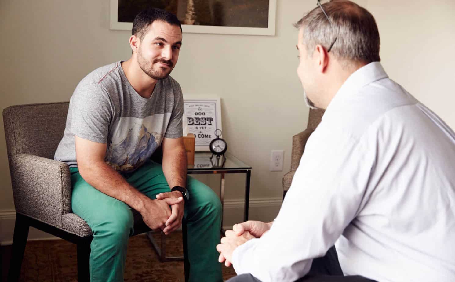 male client receives addiction counseling in office