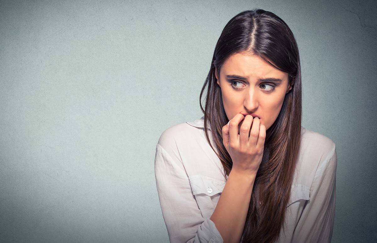 anxious woman looking to her right and avoiding small talk