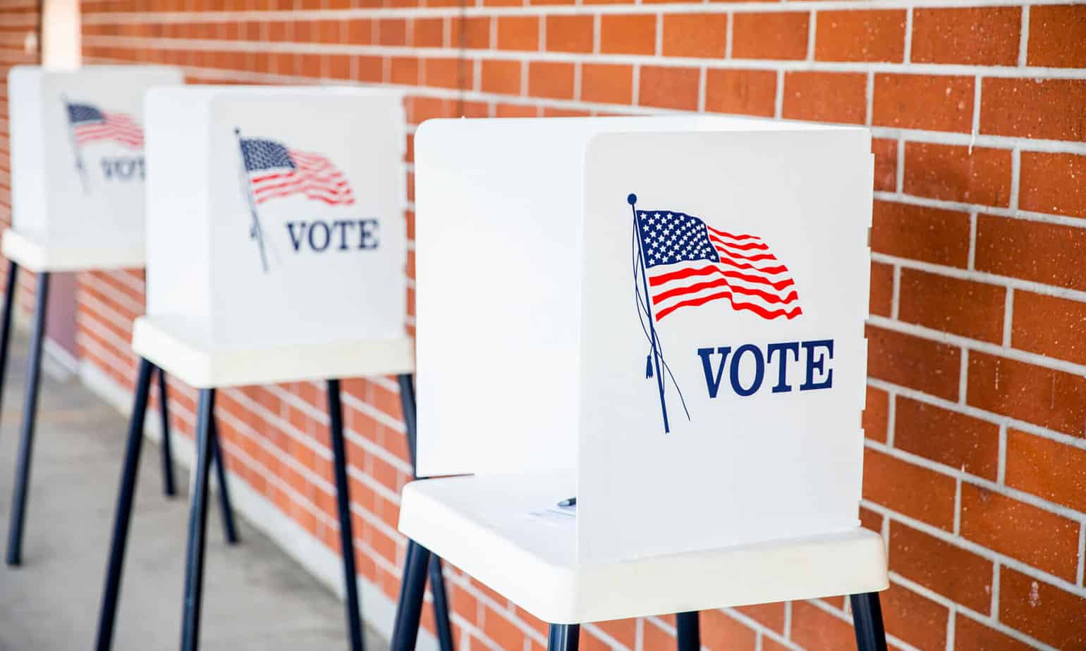 voting booths positioned outside of school building