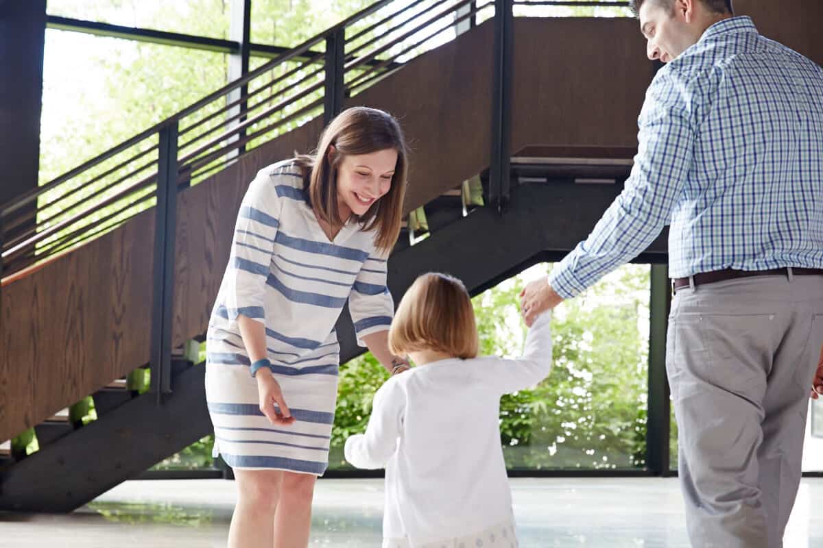 Mom meeting with her young child and husband in the Mountainside Addiction Treatment Center lobby