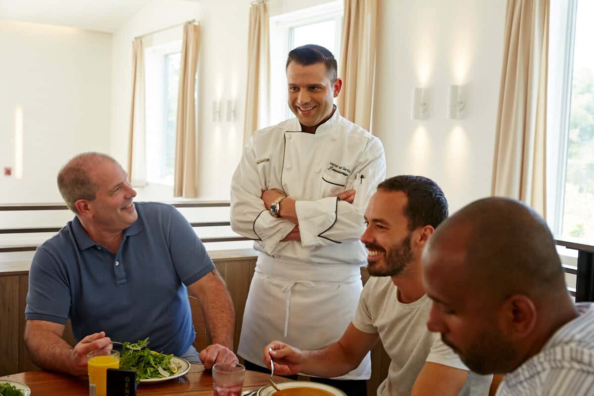 Dining Hall Staff chatting with Mountainside addiction treatment center clients in the Canaan dining hall.