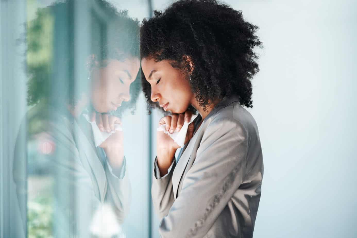 Shot of a young business woman looking stressed out in an office