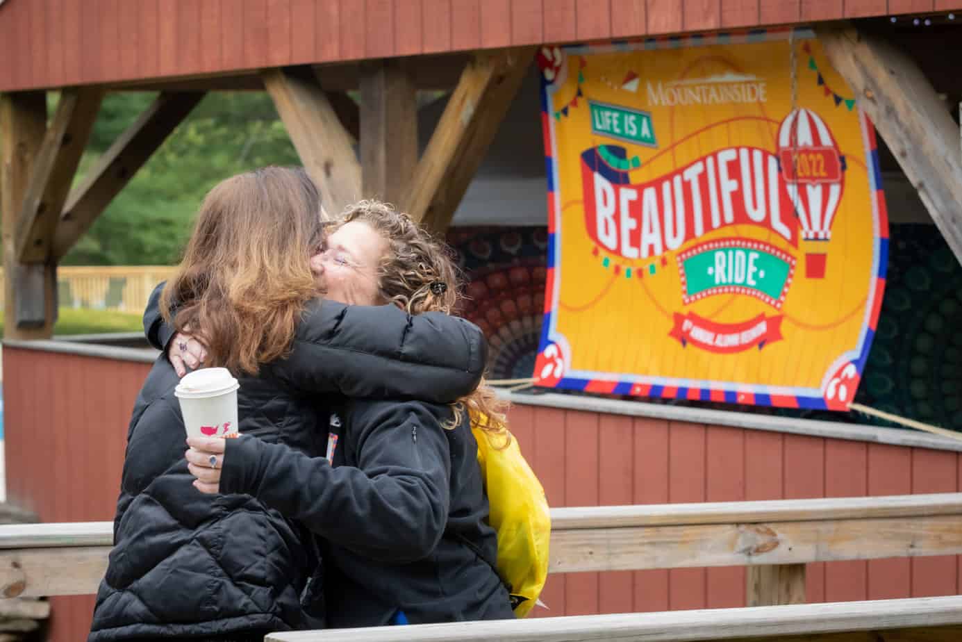Two attendees hugging at the Mountainside Alumni Reunion 2022.