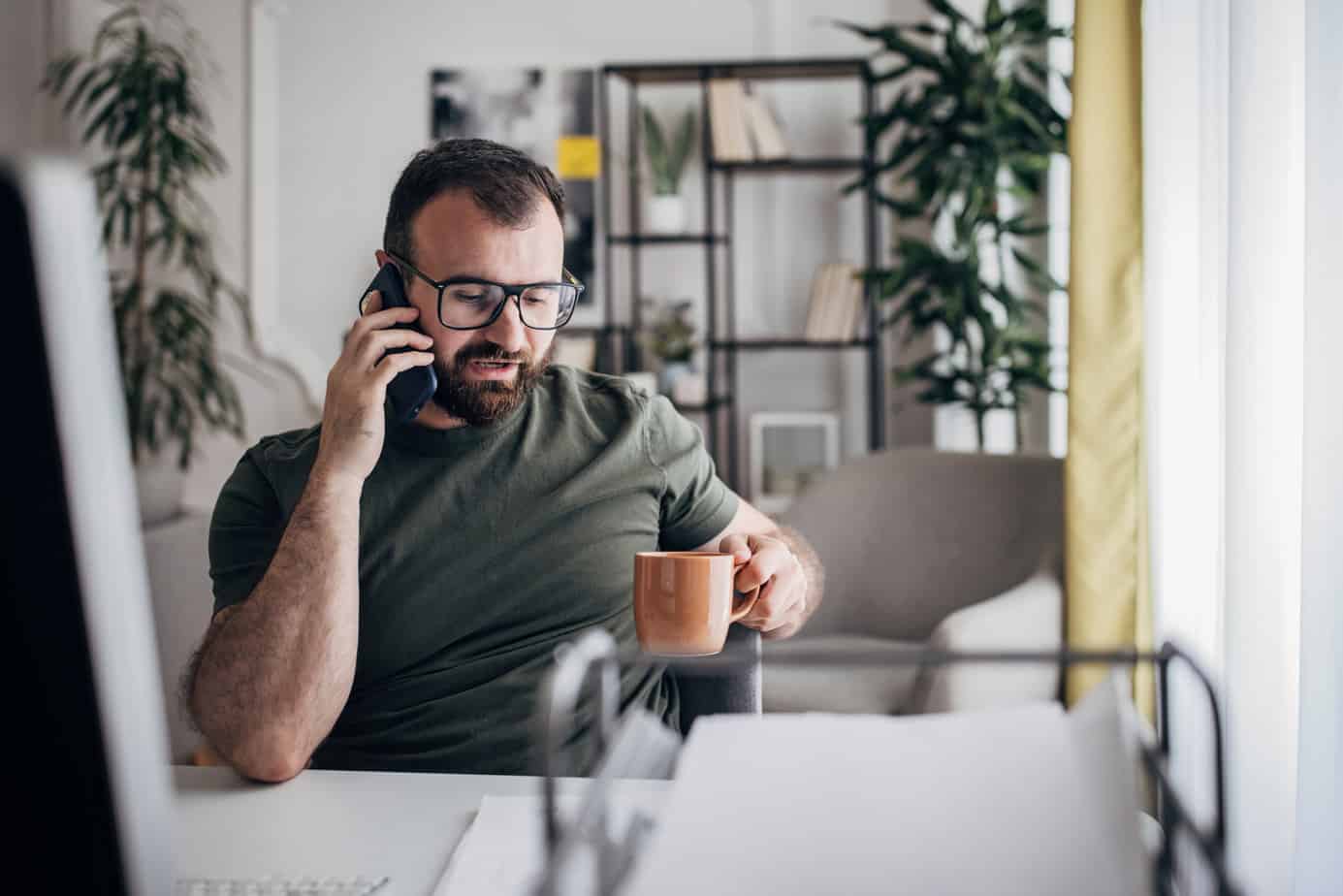 man calling insurance to inquire about coverage for addiction treatment