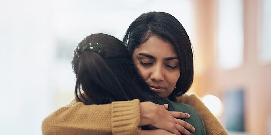 woman hugging a loved one
