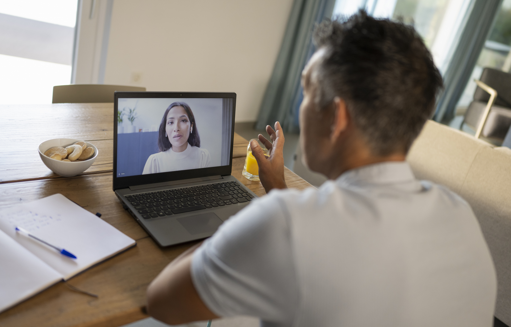man attending virtual therapy session for family addiction