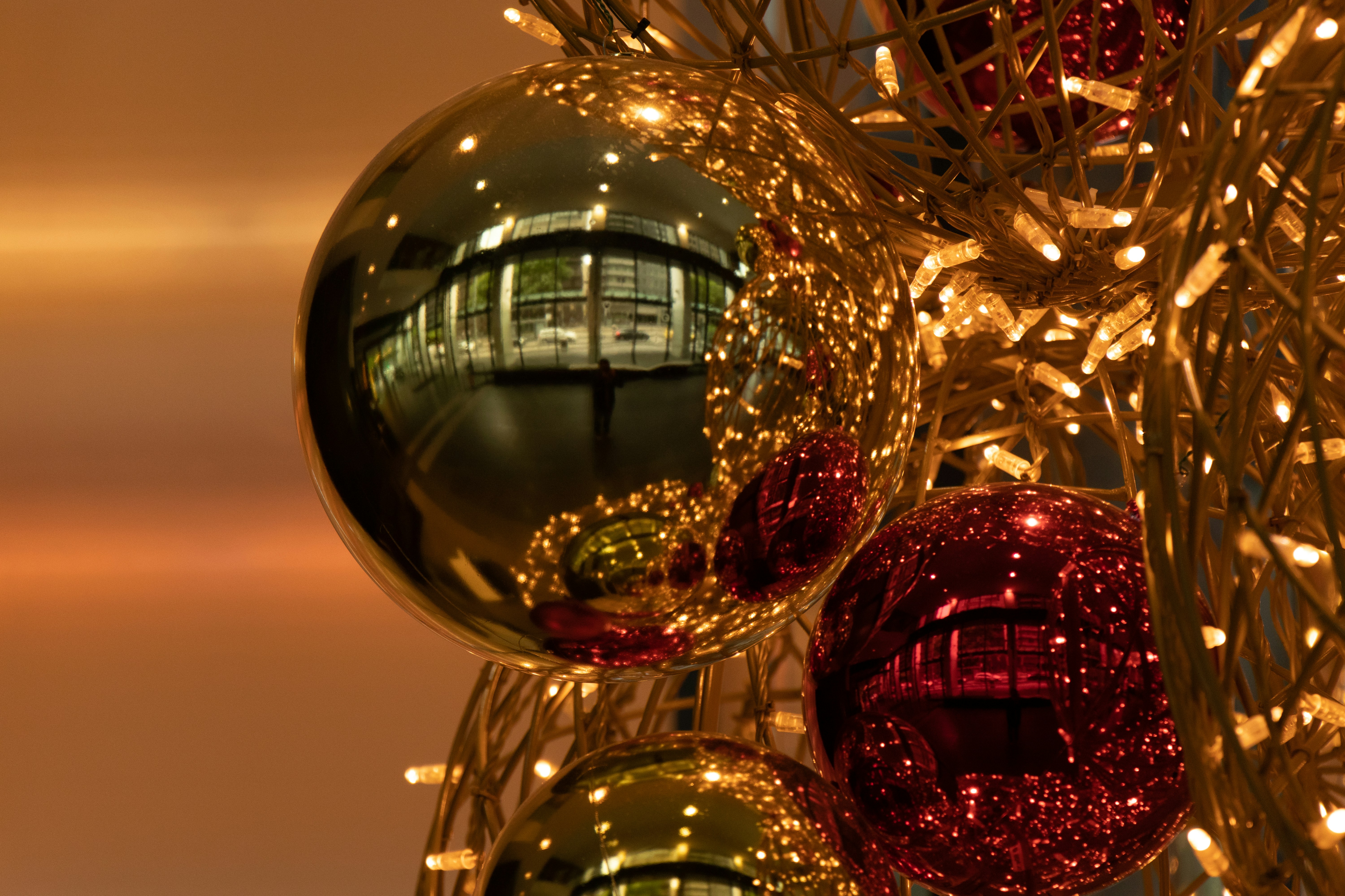 Christmas ornament hangs on a tree during a sober holiday party